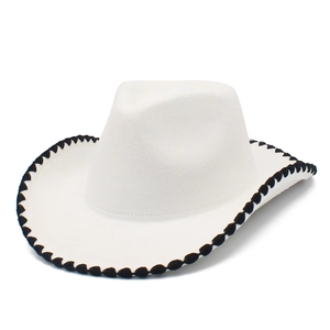 Close-up of white felt cowboy hat featuring black braided trim and smooth suede texture