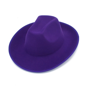 Detail view of smooth wool felt texture on a deep purple British style fedora hat