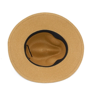 Close-up of internal woven texture and black sweatband of the wide brim straw sun hat