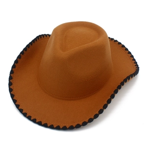 Close-up of brown wool felt cowboy hat featuring black wave stitched brim decoration