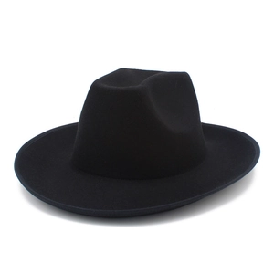 Detail view of the black wool felt fedora hat featuring a wide brim and classic pinched crown