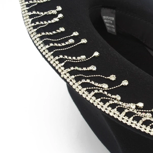 Black western cowboy hat with sparkling rhinestone fringe trim and wide brim detail