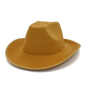 Close-up of a wide brim camel felt fedora hat with high-quality binding edge detail