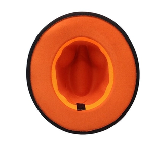 Close-up of internal label showing 65% cotton and 35% polyester blend on orange felt hat