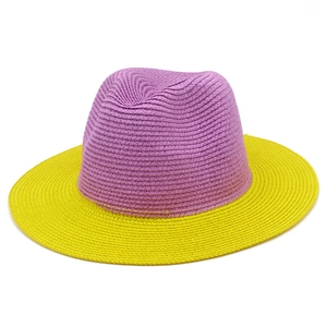 Detailed top view of bicolor sun hat showing fine woven straw texture in lilac and yellow