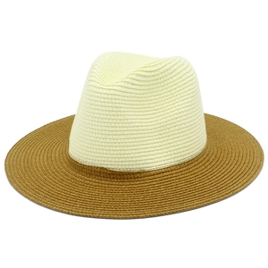 Close-up of the fine woven straw texture on a two-tone panama fedora hat with wide brim
