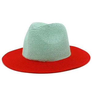 Detailed weave texture of the mint green crown and red brim on the Panama hat