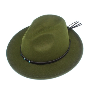 Detail view of dark green wool fedora with blue beaded leather band and black fringe tassel