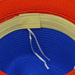 Close-up of dual-color straw hat interior with sweatband and adjustable drawstring
