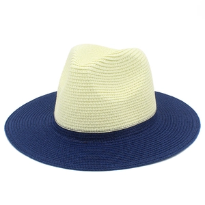 Detailed close-up showing the two-tone weave texture of a straw fedora sun hat