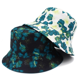 Detail of reversible sun hat with tropical green hibiscus floral print and stitching