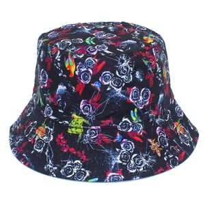 Close-up of floral bucket hat featuring colorful parrots and blue rose patterns