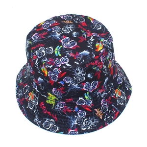 Top view of bucket hat with floral print featuring white roses and colorful butterflies