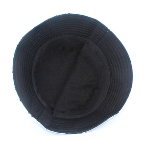 Detailed interior view of black bucket hat showing stitching and soft fabric lining