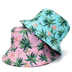 Pink and blue reversible bucket hats with tropical flamingo and palm tree patterns