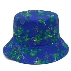 Double-sided floral bucket hat for women in dark blue with tropical flower pattern