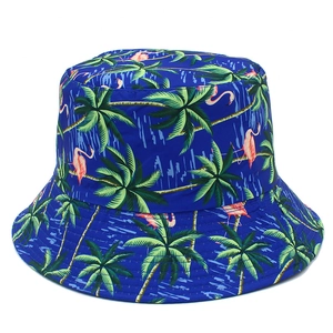 Detail of navy bucket hat with pink flamingo and green palm tree tropical prints