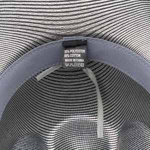 Detail view of the disco cowboy hat interior with grey sweatband and material care label