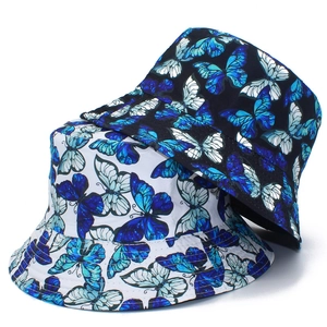 Women's reversible bucket hats with colorful butterfly prints in black and white styles