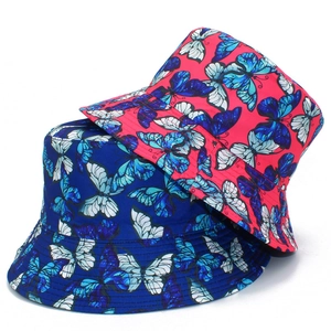 Reversible bucket hat for women with colorful butterfly prints in pink and navy blue cotton