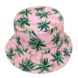 Detail of tropical palm trees and flamingo print on pink foldable canvas bucket sun hat