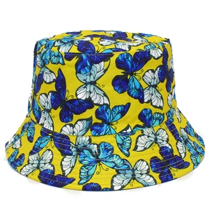 Yellow bucket hat featuring colorful butterfly prints with durable stitched brim for women