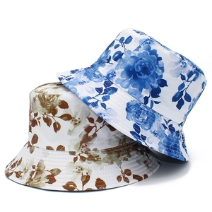 Detailed view of bucket hat with ink flower print and reinforced stitching on the brim