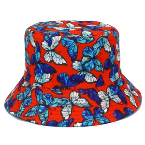 Detailed close-up of a red bucket hat featuring colorful butterfly prints and clean stitching