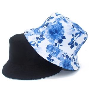 Detail of floral bucket hat with ink painting pattern and black sun hat stitching