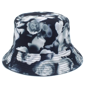 Chic black and white floral print bucket hat with durable stitching for sun protection
