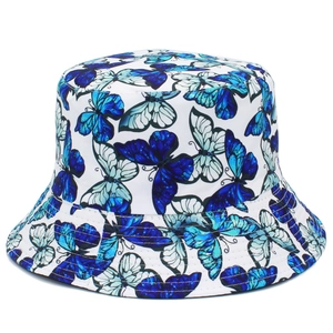Detail of colorful butterfly pattern and neat stitching on a white reversible bucket hat