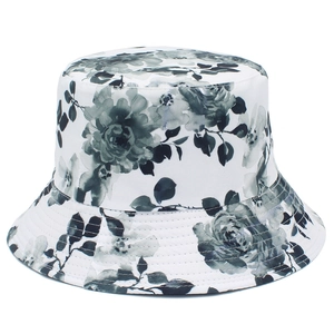 Summer women's foldable sun hat featuring black ink floral print on a white bucket hat