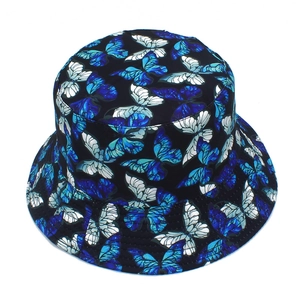 Macro view of bucket hat with colorful butterfly pattern and durable stitching details