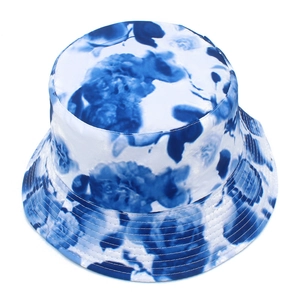 Detailed view of blue and white floral bucket hat with satin finish and reinforced brim stitching