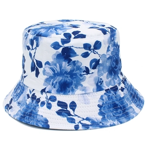 Detail showing blue ink floral print and parallel stitching on white cotton bucket hat