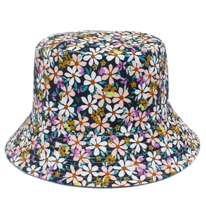 Close-up of floral bucket hat featuring detailed stitching and daisy flower patterns