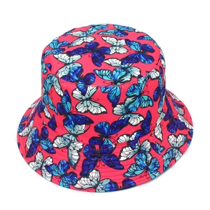 Detailed view of colorful butterfly print on red cotton sun hat with firm texture
