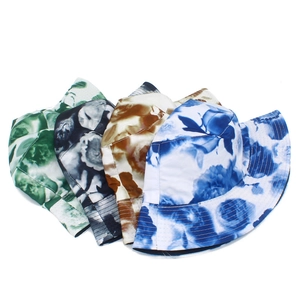 Detail view of colorful floral pattern bucket hats with reinforced stitching on the brim