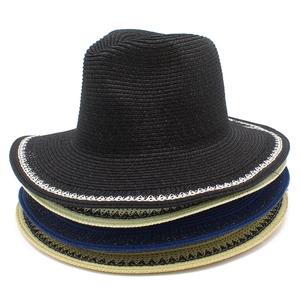 Stack of four elegant French fedora straw hats in black, cream, navy, and yellow for sun protection