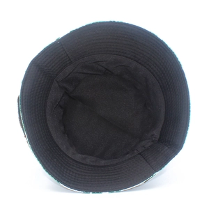 Detail view showing black fabric lining and fine stitching of the ink floral sun hat