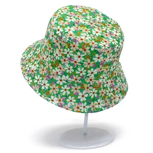 Close-up of small floral patterns on a green cotton canvas reversible sun bucket hat