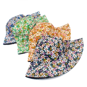 Floral reversible bucket sun hat with daisy print patterns for women in four summer colors