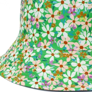 Detailed close-up of floral sun hat featuring neat white stitching and daisy patterns