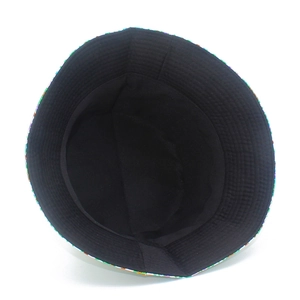 Overhead detail of floral sun hat featuring black inner lining and colorful rainbow brim trim