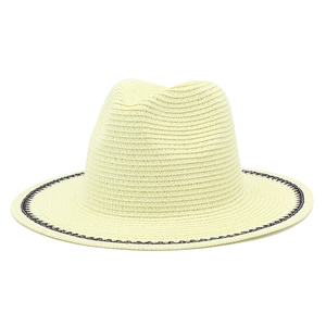 Elegant French straw sun hat with black and white woven trim for summer beach outings