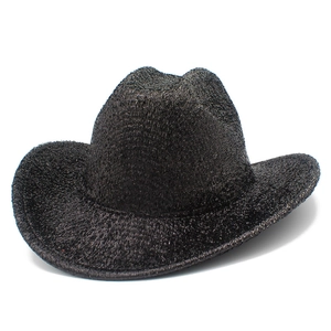 Close-up of black cowboy hat with metallic glitter finish and woven texture details