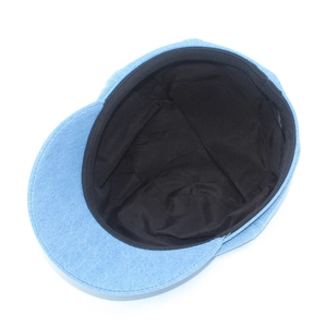 Internal view of light blue denim beret showing black lining and clean sweatband seams