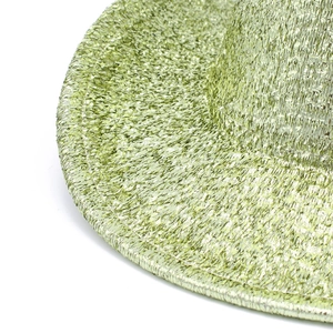 Detail view of light green sequined fedora hat showing woven texture and shimmering finish