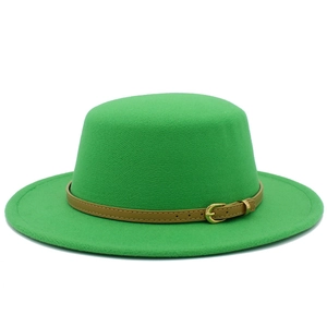 Detail view of grass green wool felt flat top hat with brown leather belt and gold buckle