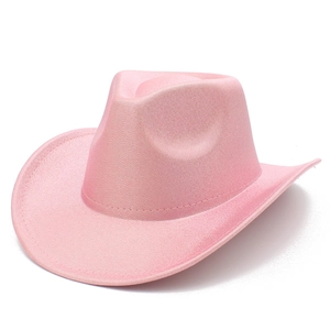 Macro detail of pink glitter fabric and stitching on a shiny Western cowboy hat